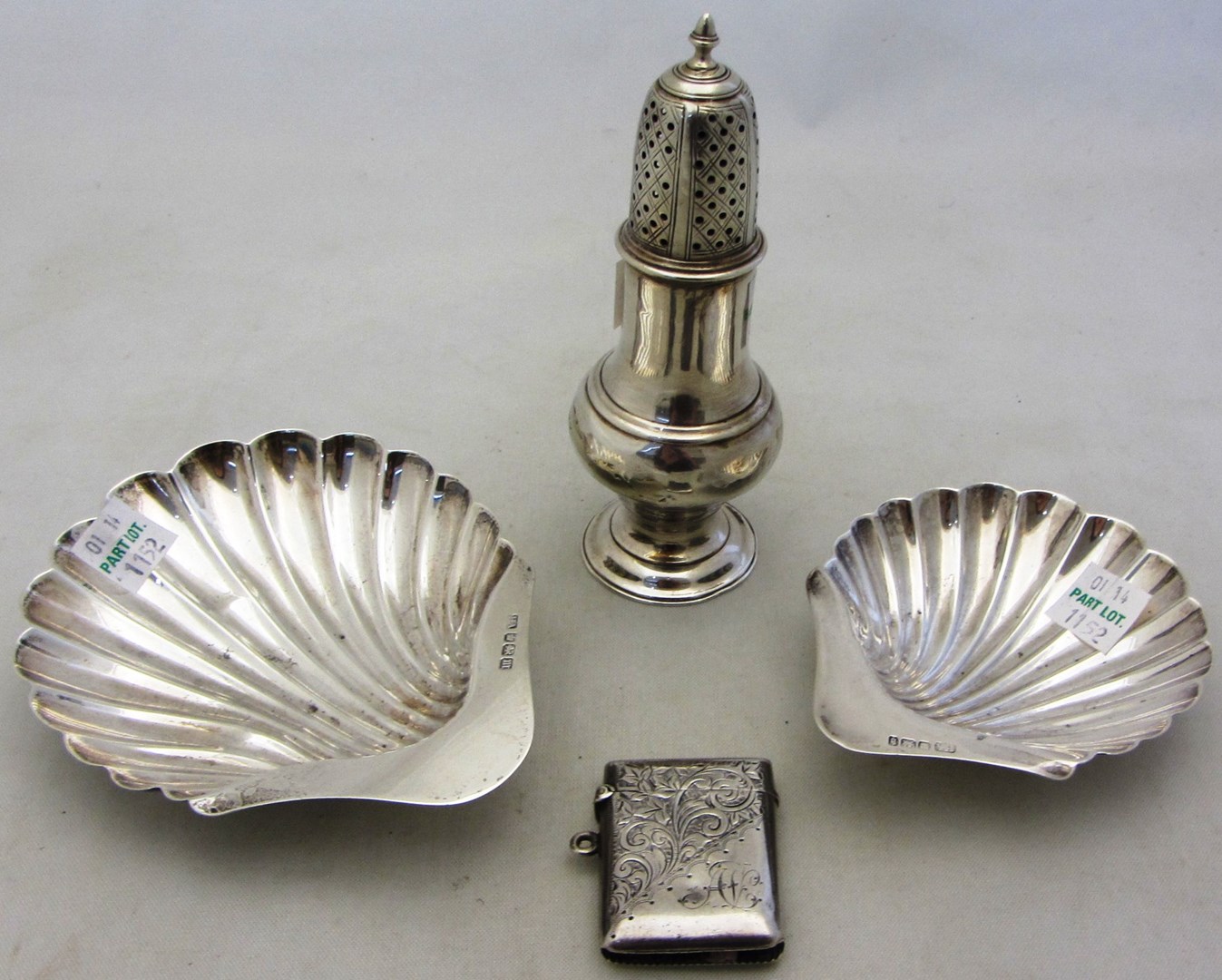 Appraisal: Silver comprising a George III baluster shaped sugar caster London