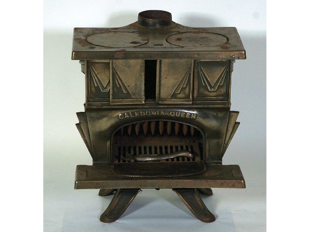 Appraisal: CALEDONIA QUEEN ART DECO CAST IRON STOVE oblong cm high