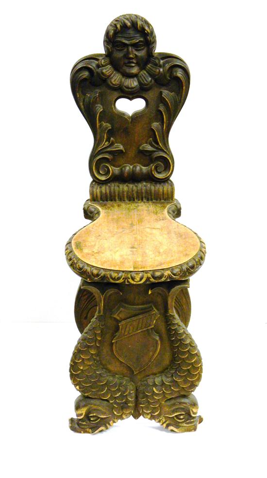 Appraisal: Baroque style carved side chair with masque and dolphin motifs