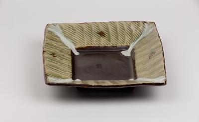 Appraisal: A square stoneware dish David Frith born with tenmoku glazed