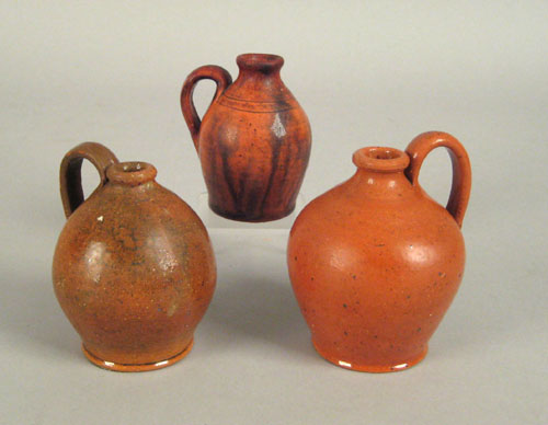 Appraisal: Three miniature redware jugs late th c h h and