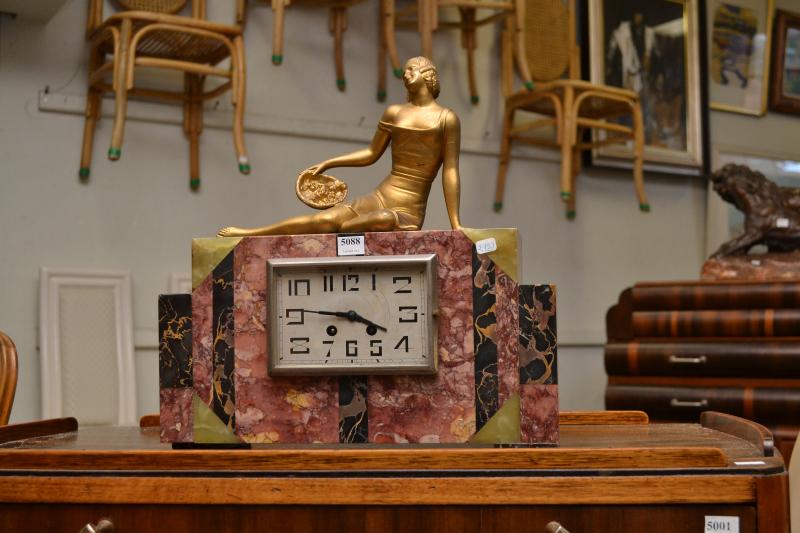 Appraisal: AN ART DECO MARBLE CLOCK FEATURING GILT WOMAN FIGURE