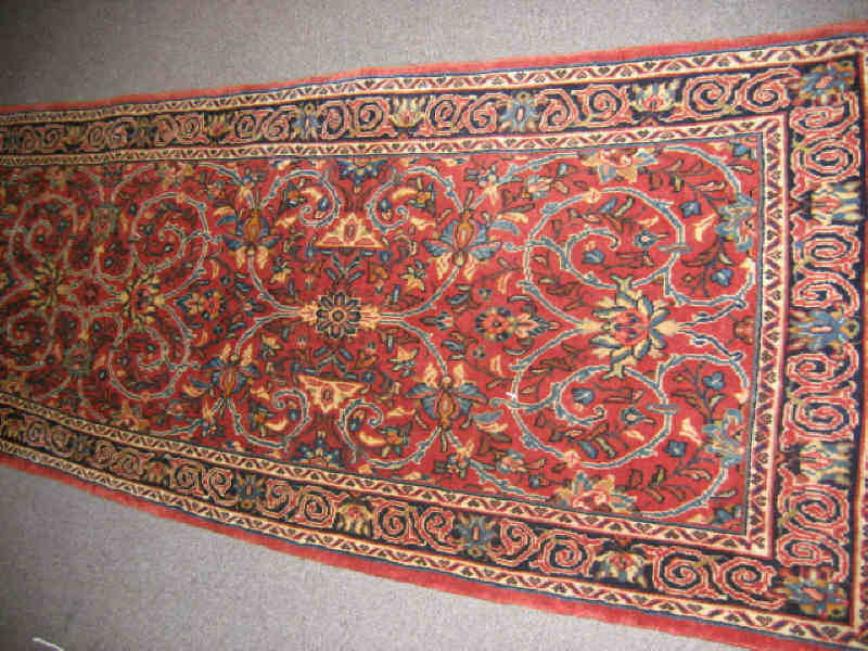 Appraisal: SAROUK RUNNER The red field of allover bold curvilinear floral