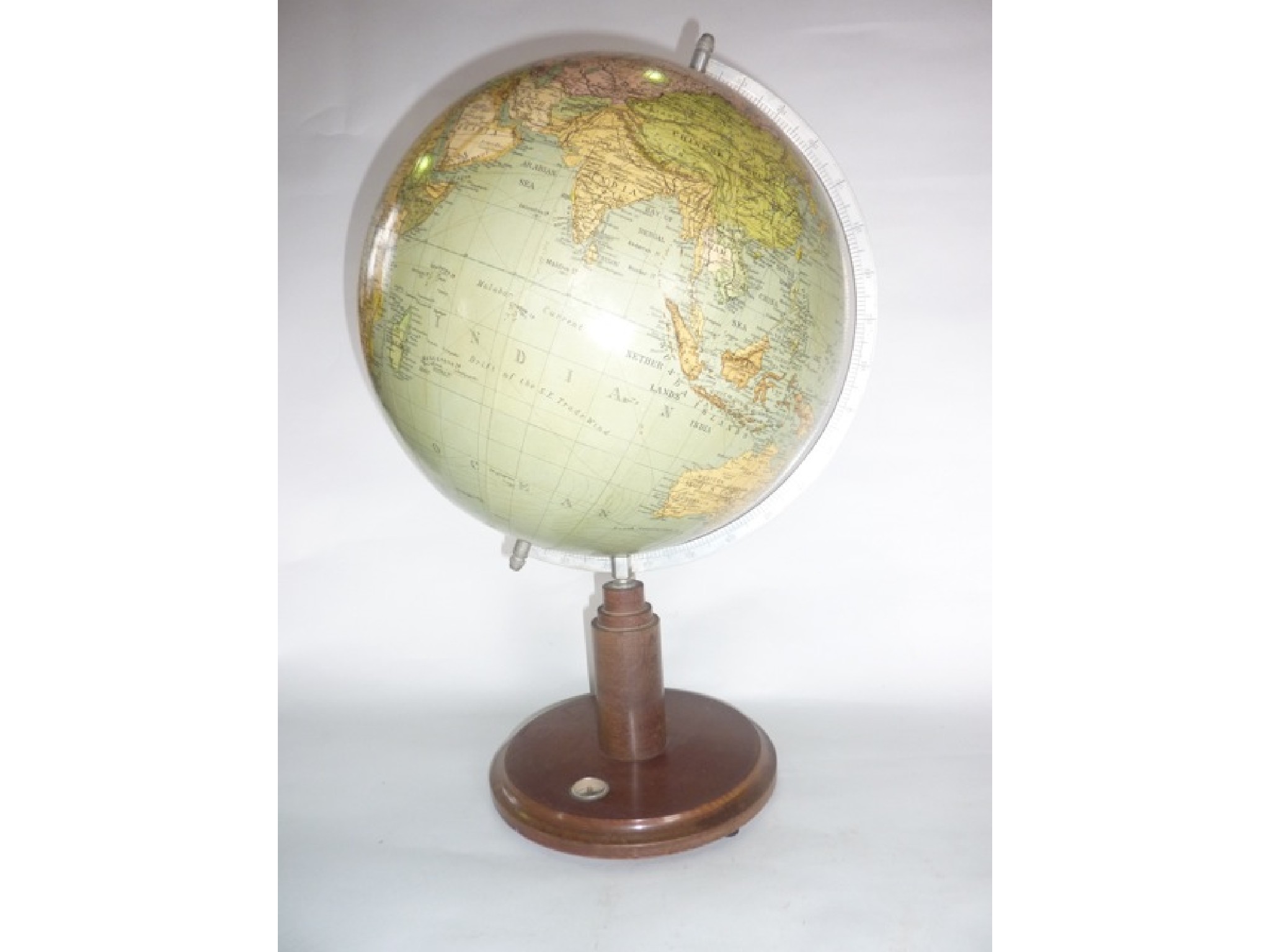 Appraisal: A th century terrestrial desktop globe raised on a turned