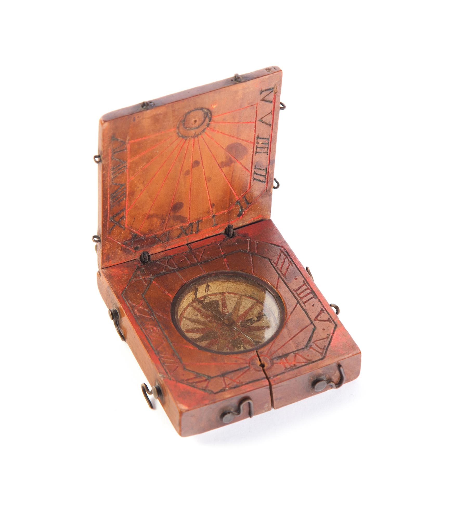 Appraisal: EUROPEAN TRAVELLING COMPASS SUNDIAL Eighteenth century or earlier Folding wooden