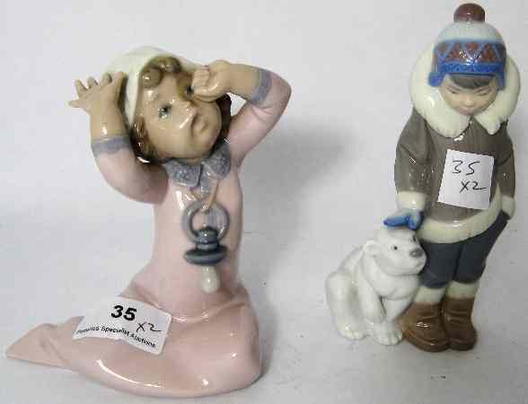 Appraisal: Lladro Figures Of Eskimo Boy with Bear Height cm And