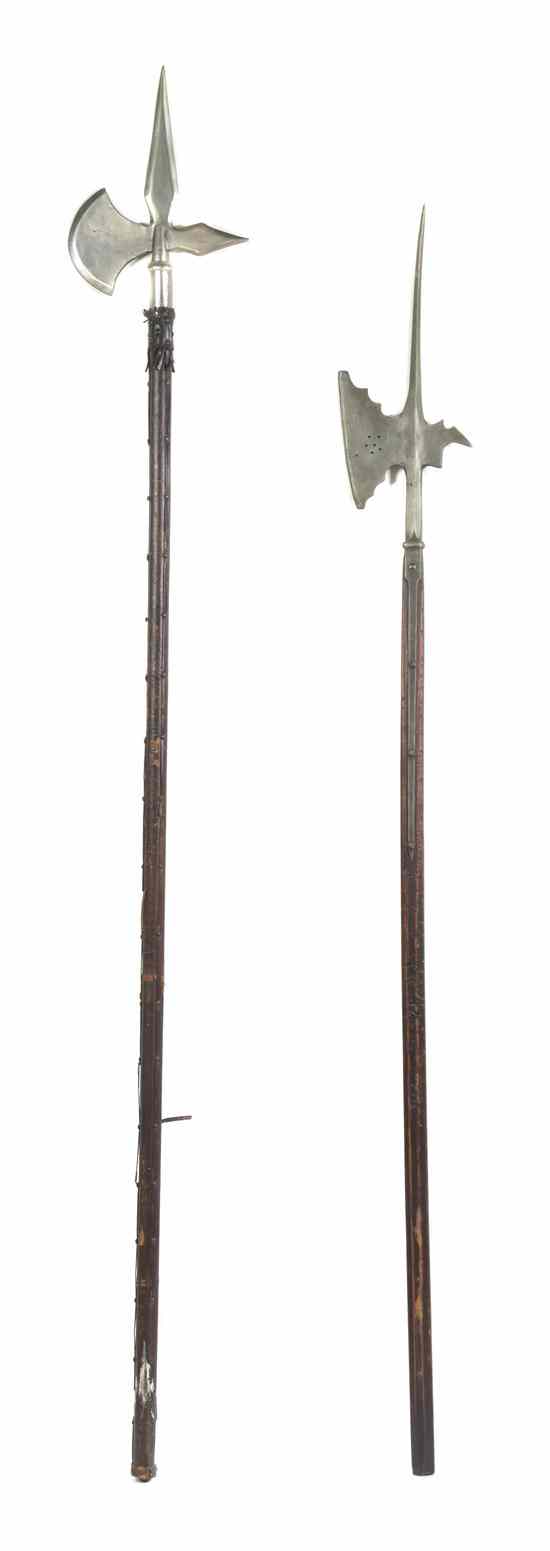 Appraisal: Four Continental Iron Halberds with turned wood standards Length of