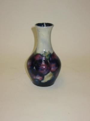 Appraisal: A MOORCROFT POTTERY VASE of bottle form tube lined in