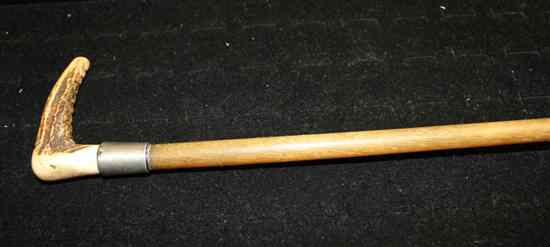 Appraisal: A rhinoceros horn riding crop c - with stag horn