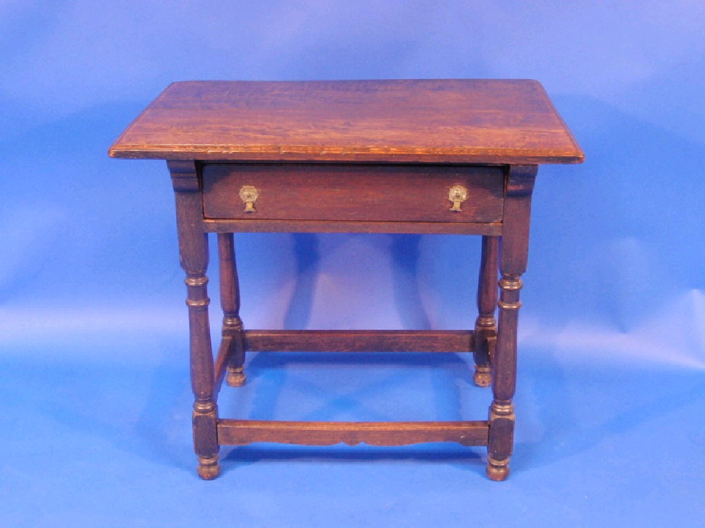 Appraisal: An thC oak side table with moulded top frieze drawer