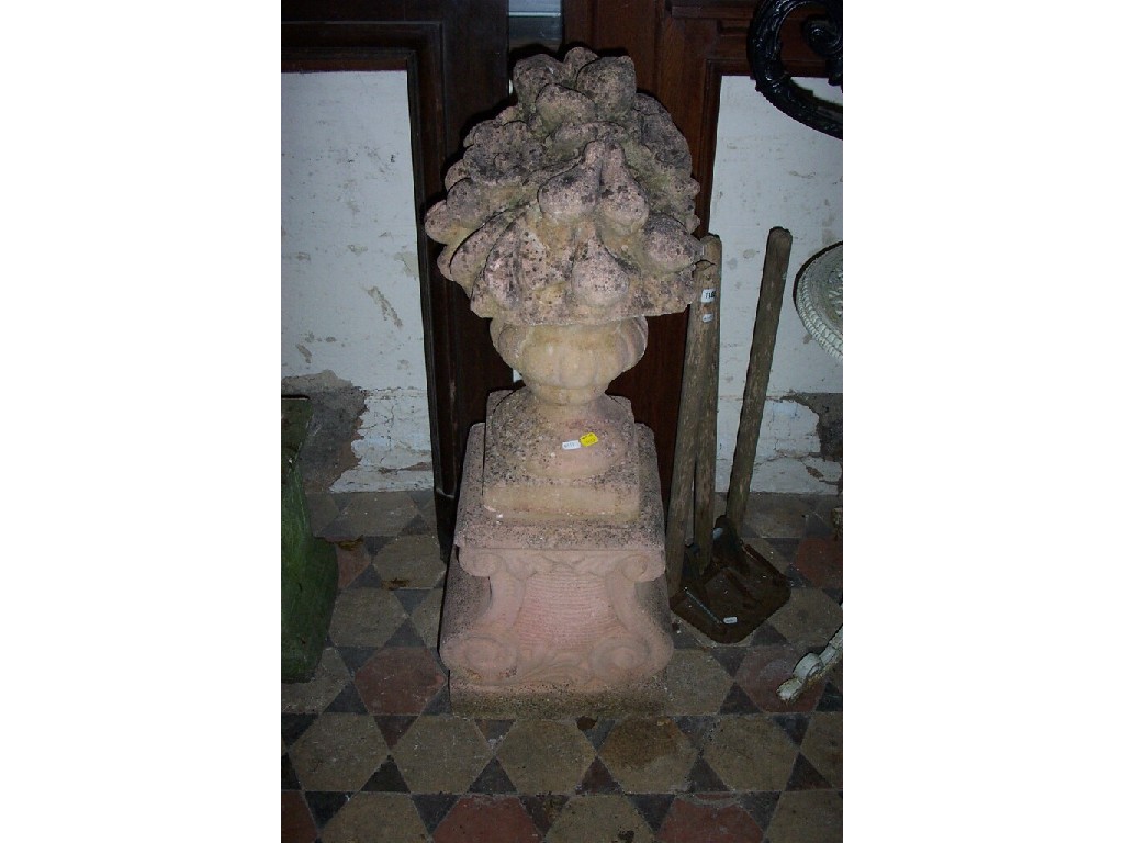 Appraisal: A pair of weathered reconstituted garden urns in the form