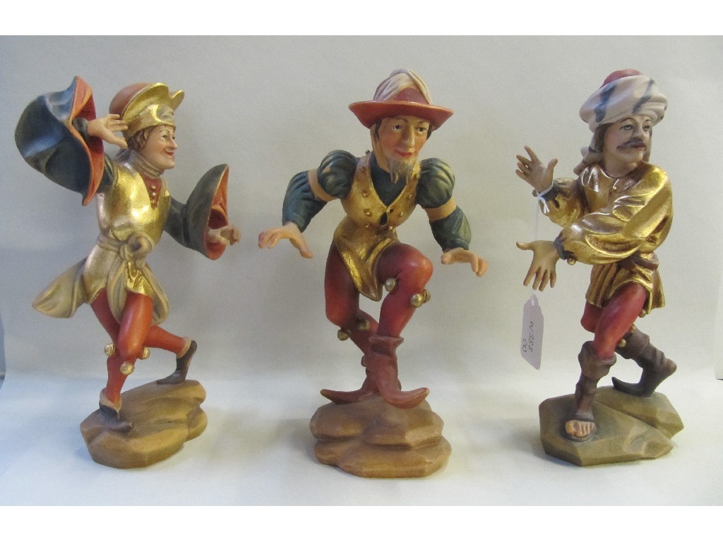 Appraisal: Three Black Forrest carved painted and gilded wood figures