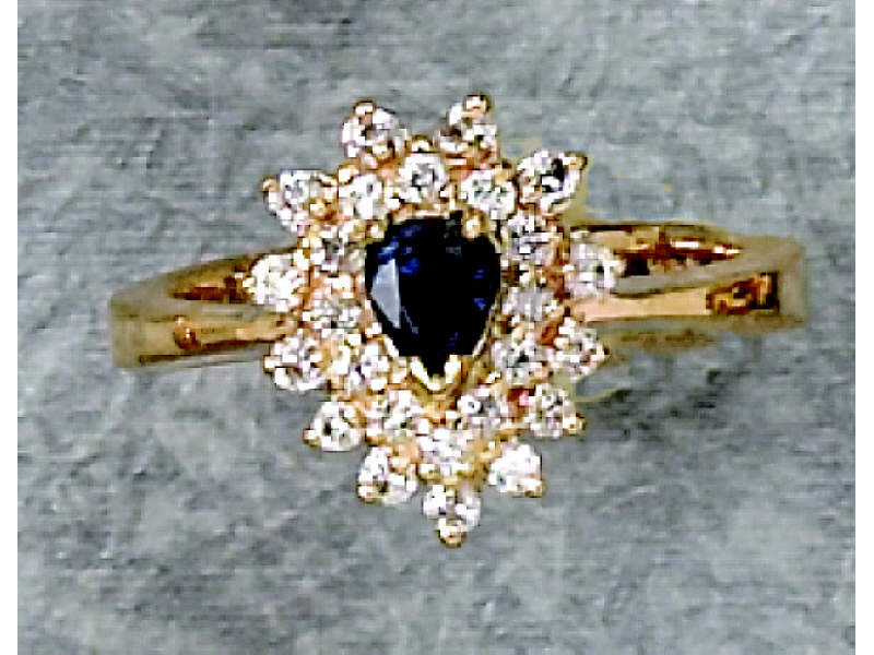 Appraisal: DIAMOND AND SAPPHIRE RING k yellow gold ring with pear