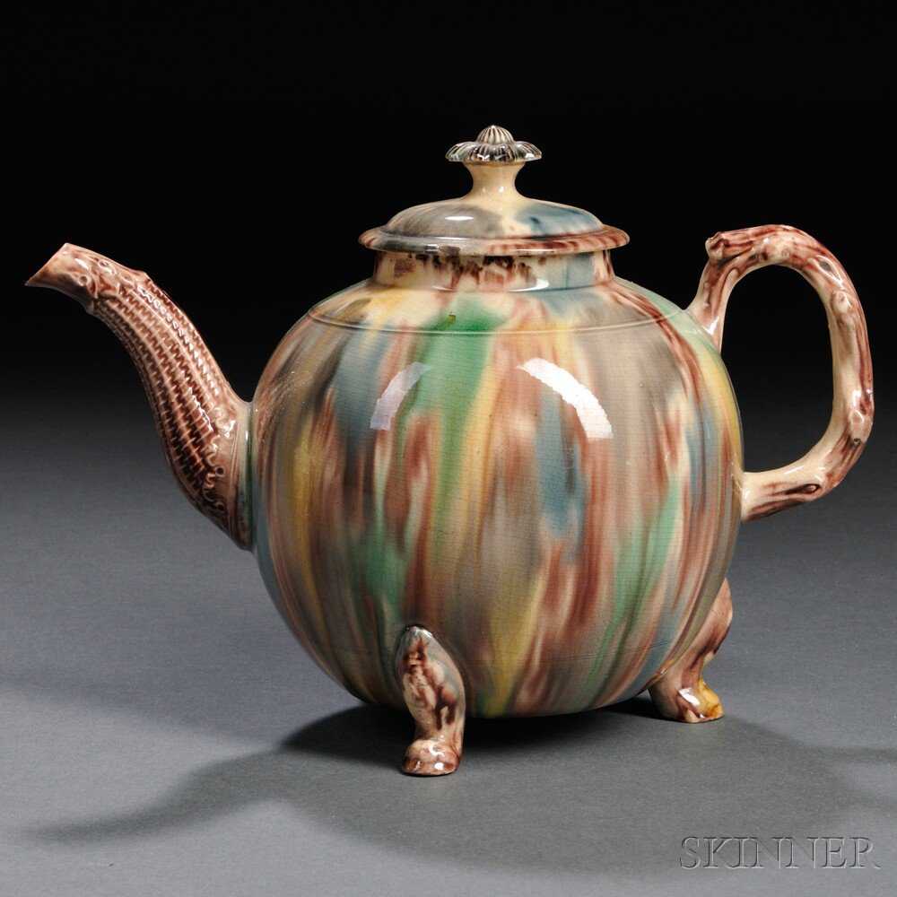 Appraisal: Staffordshire Cream-colored Earthenware Teapot and Cover England c globular shape