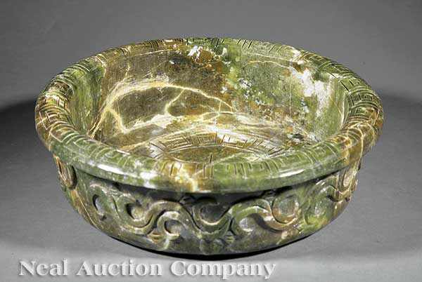 Appraisal: A Monumental Chinese Jade or Serpentine Basin the mottled green