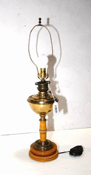 Appraisal: An English caramel glazed pottery and brass oil lamp early