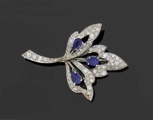 Appraisal: DIAMOND SAPPHIRE BROOCH White gold Decorative open-worked brooch in the