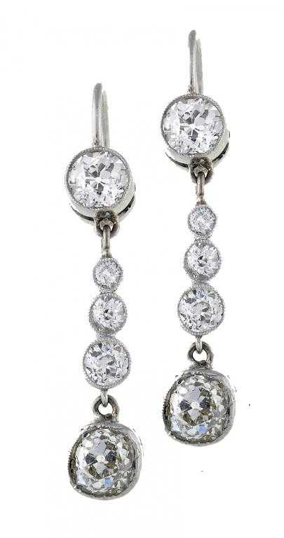 Appraisal: A PAIR OF DIAMOND EARRINGS of five articulated collets