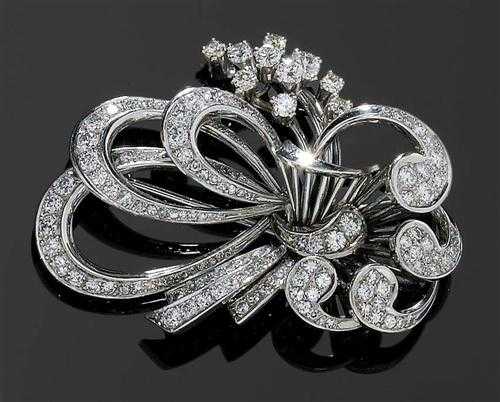 Appraisal: DIAMOND BROOCH ca White gold Elegant brooch in a stylised