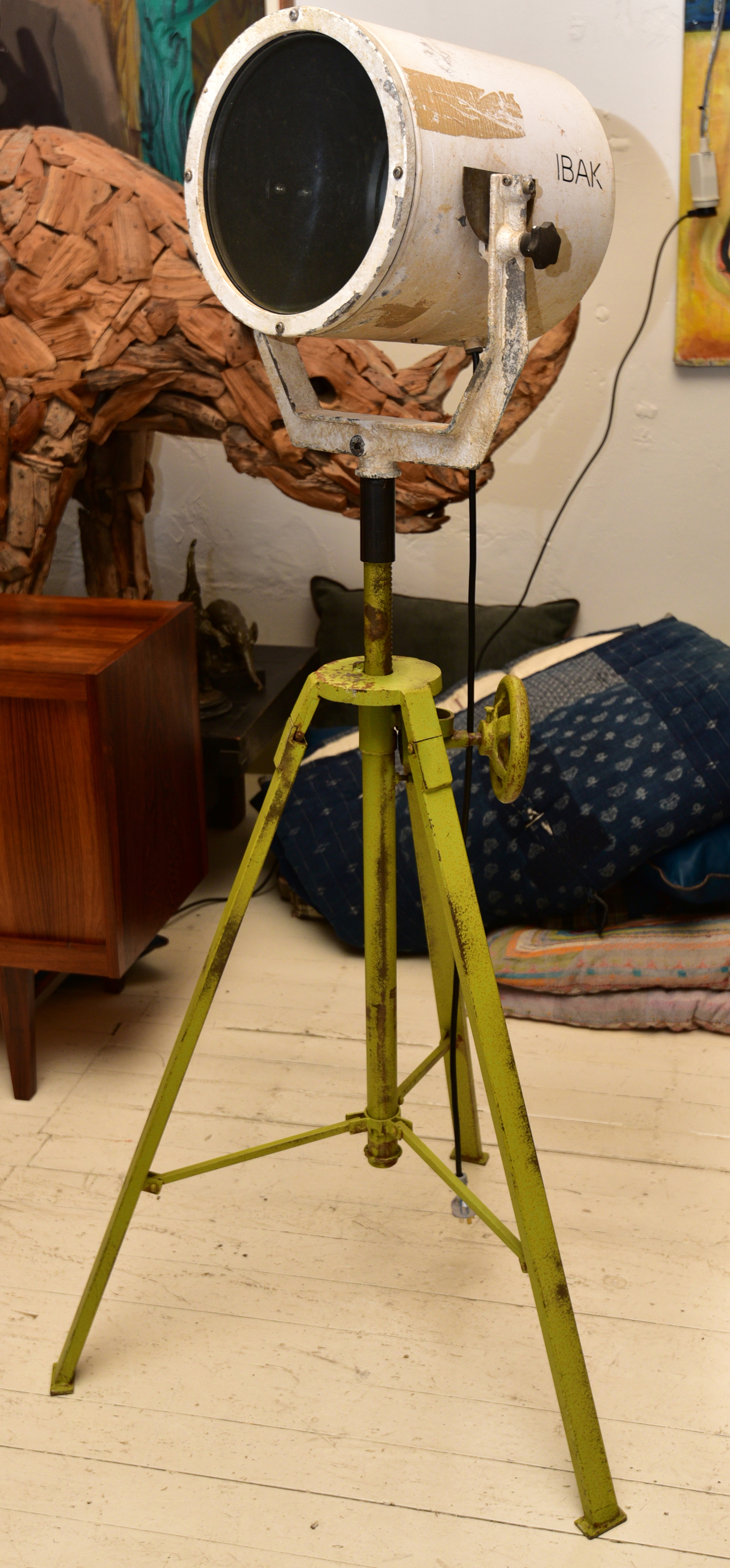 Appraisal: A VINTAGE FLOODLIGHT ON AN IRON TRIPOD STAND h x