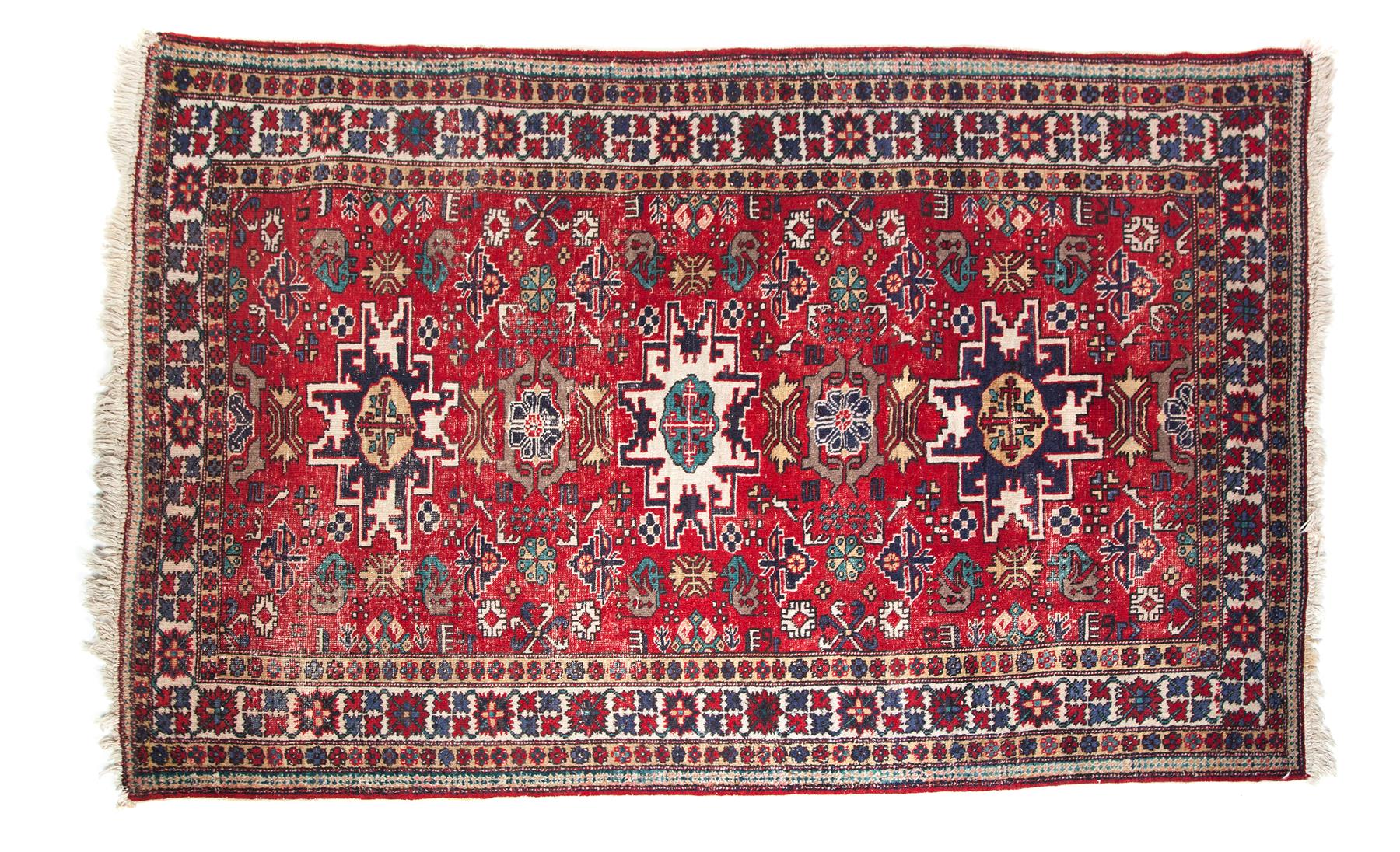 Appraisal: PERSIAN TRIBAL AREA RUG Twentieth century Red field with geometric