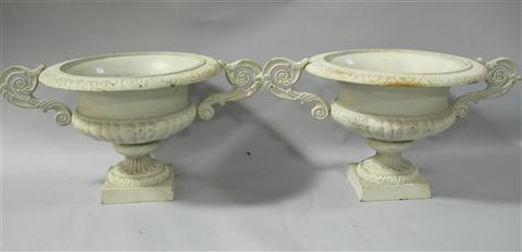 Appraisal: PAIR OF CAST IRON GARDEN URNS Of traditional urn form