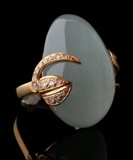 Appraisal: AN K GOLD MOONSTONE AND DIAMOND RING A vintage fashion