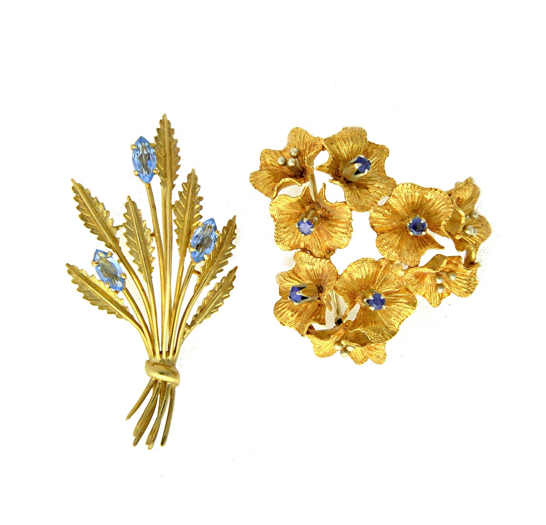 Appraisal: A gold and sapphire set brooch in an abstract floral