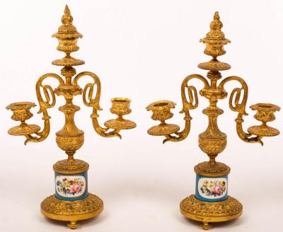 Appraisal: A pair of French two branch three-light table candelabra on