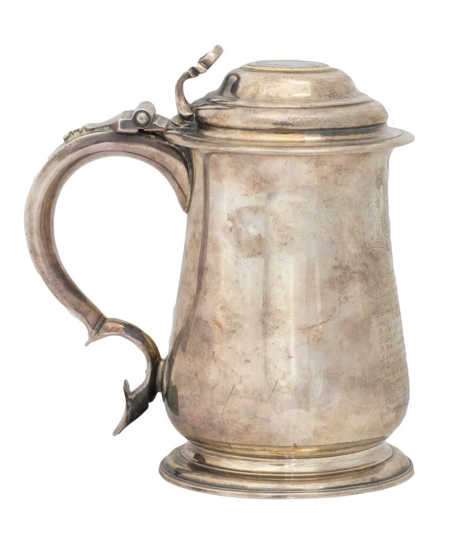 Appraisal: A George II silver hinge lidded tankard of baluster form