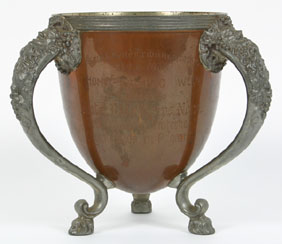 Appraisal: Presentation cup with copper body Bacchus embossed white metal handles