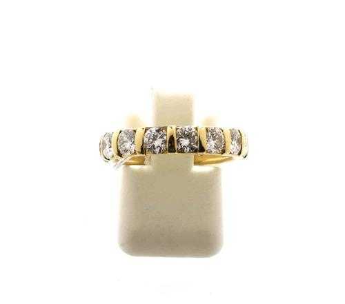 Appraisal: BRILLIANT-CUT DIAMOND RING Yellow gold Modern wedding band model with