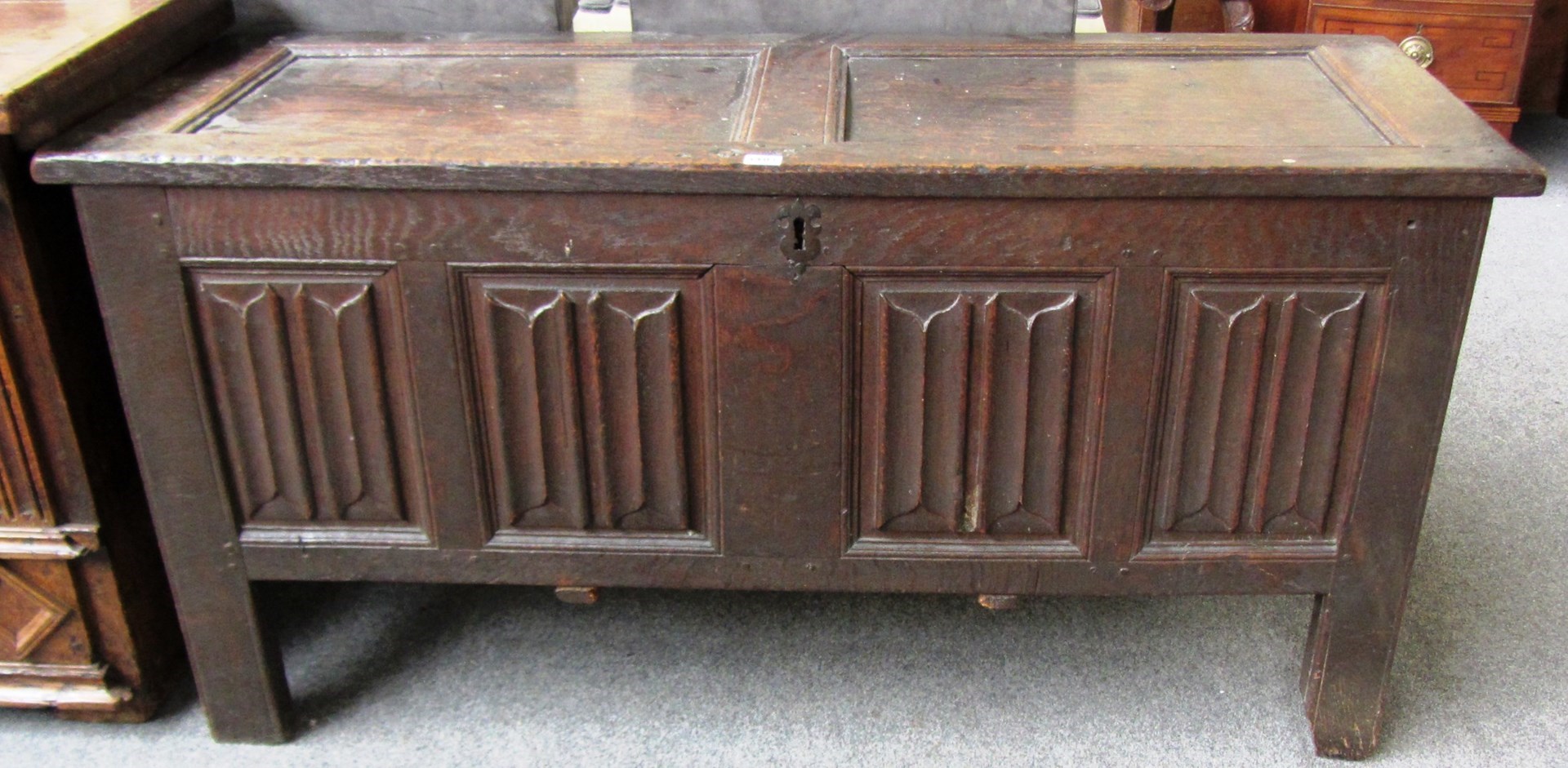 Appraisal: A th century oak coffer with double panel lid over