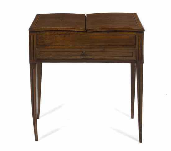 Appraisal: A Continental Mahogany Work Table having twin hinged lids with