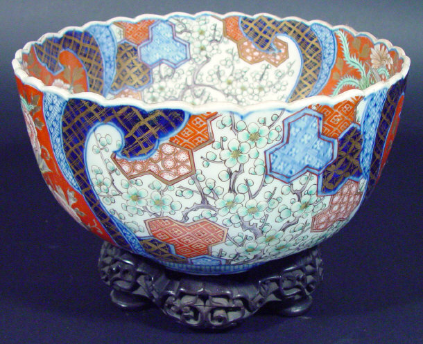 Appraisal: Japanese Imari porcelain bowl of fluted form profusely enamelled and