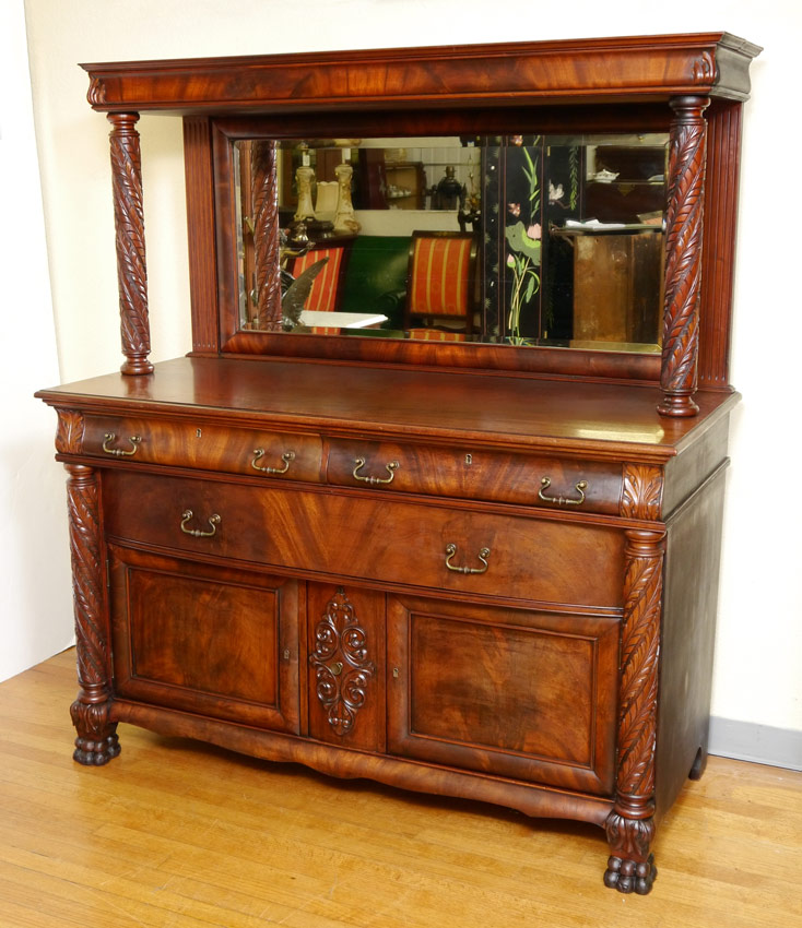 Appraisal: EDWARDIAN MAHOGANY CARVED SIDEBOARD Top with applied carved decoration at