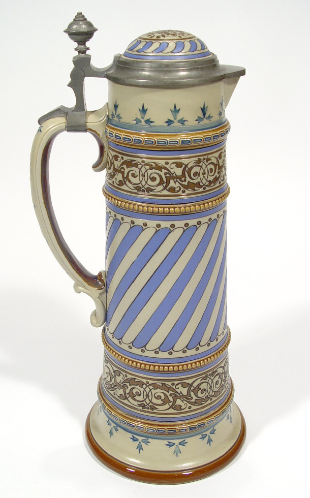 Appraisal: Large Mettlach stoneware flagon with pewter mount and incised and