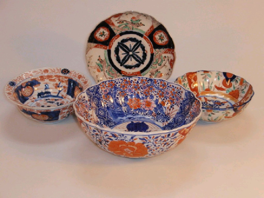 Appraisal: An Imari bowl with wavy rim an Imari plate two