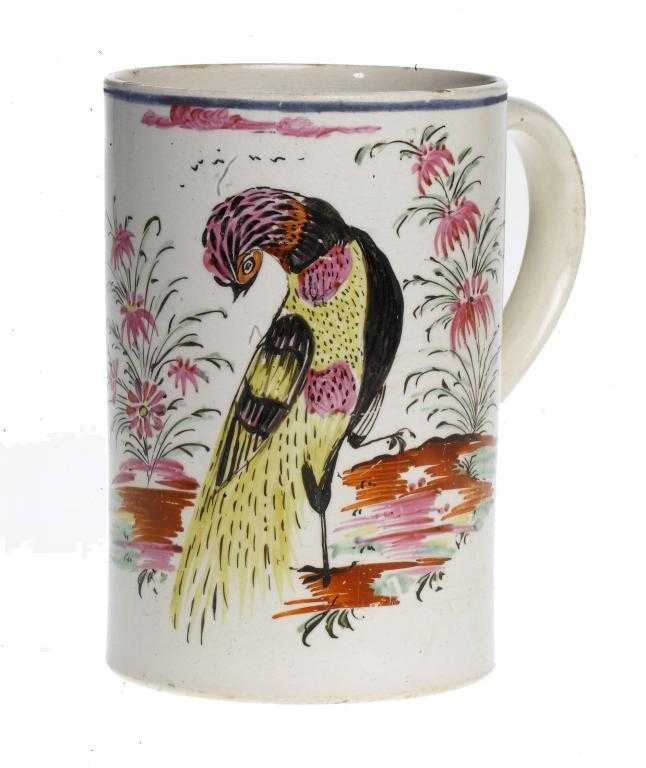 Appraisal: A PAINTED PEARLWARE MUG boldly decorated with an exotic bird