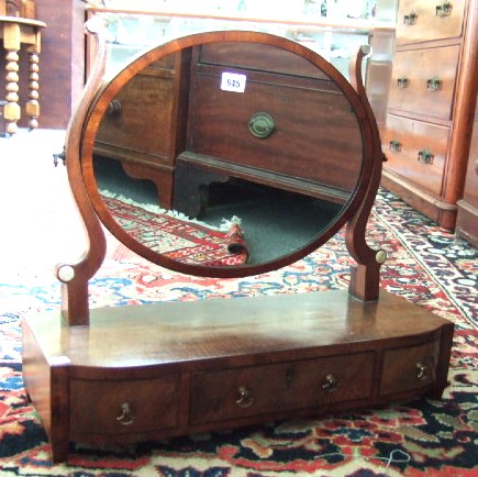 Appraisal: An early Victorian mahogany swing frame toilet mirror the oval