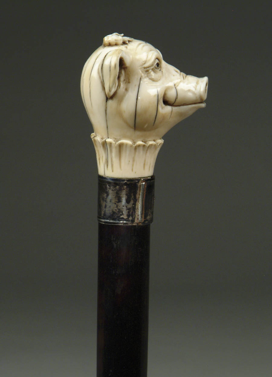 Appraisal: CARVED IVORY PIG HEAD CANE This fabulous modeled pig head