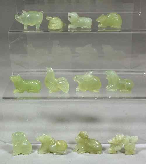 Appraisal: Twelve Chinese carved pale green hardstone animals representing the Signs