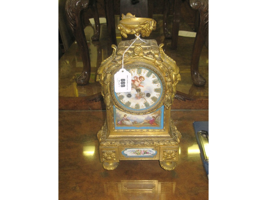 Appraisal: French ormolu mantle clock inset with Sevres panels pendulum and