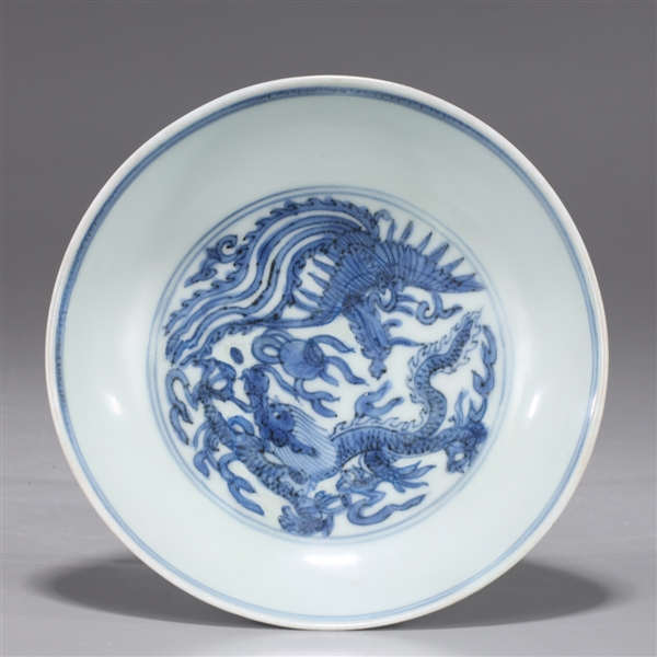 Appraisal: Chinese blue and white porcelain dish with dragon and phoenix