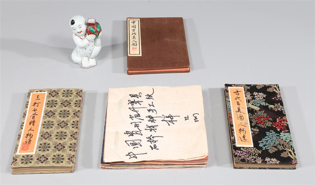 Appraisal: Group of five Chinese portrait books porcelain figure and pressed