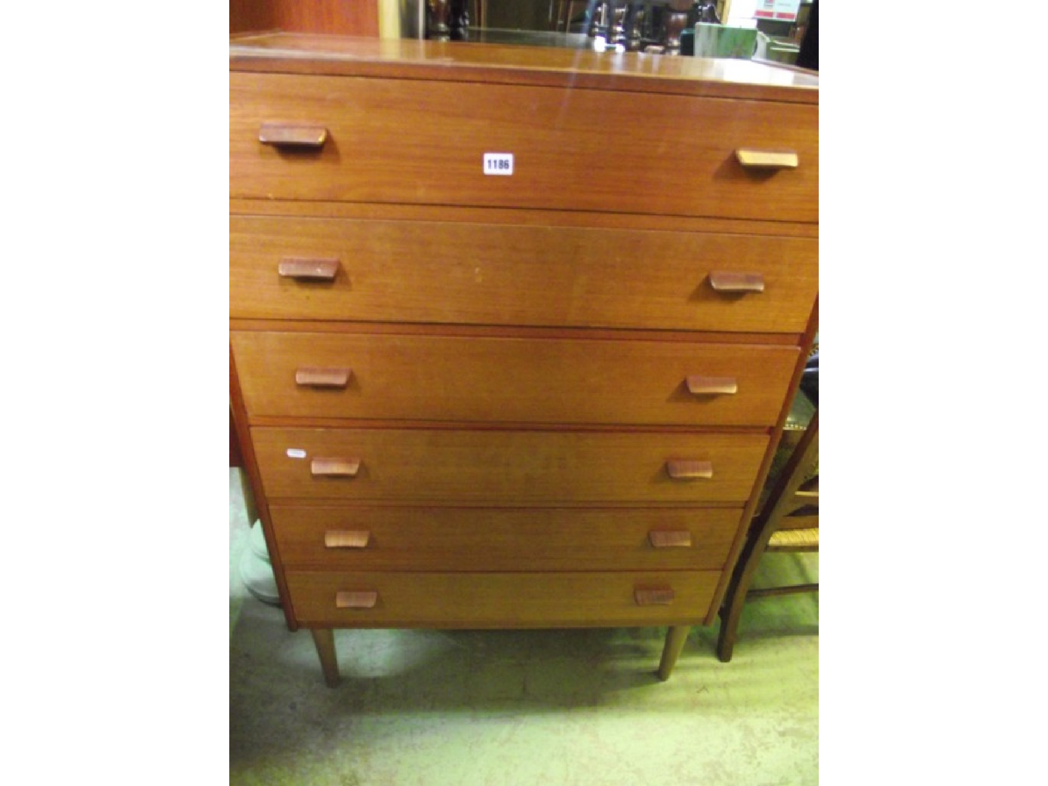 Appraisal: A mid th century teak bedroom chest of six long