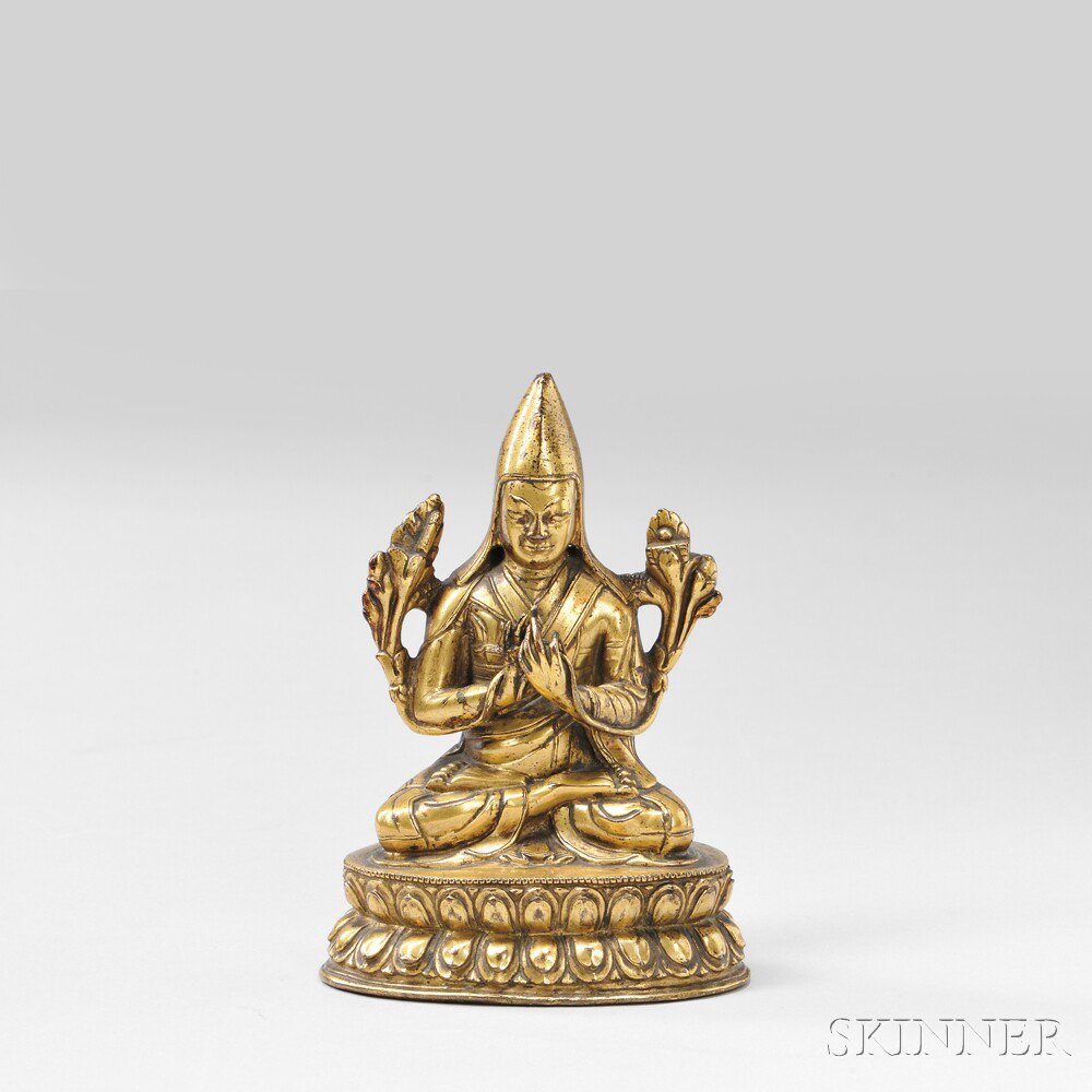 Appraisal: Gilt-bronze Figure of Lama Tibet th century dressed in a