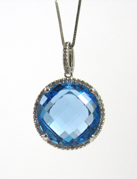 Appraisal: BLUE TOPAZ AND DIAMOND PENDANT NECKLACE suspended on a inch