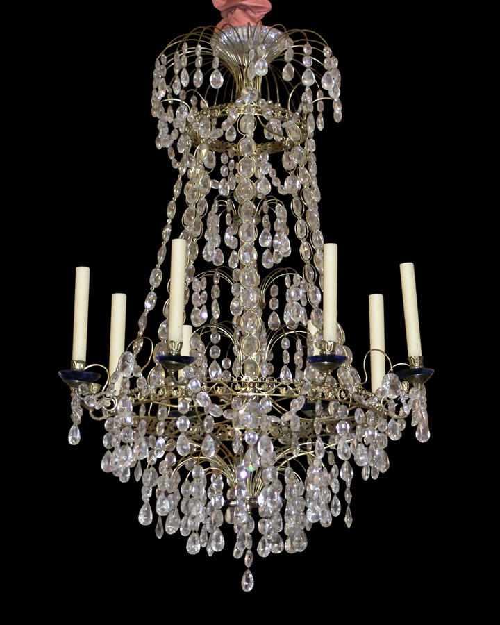 Appraisal: A Swedish Neoclassical style eight light chandelier The brass frame