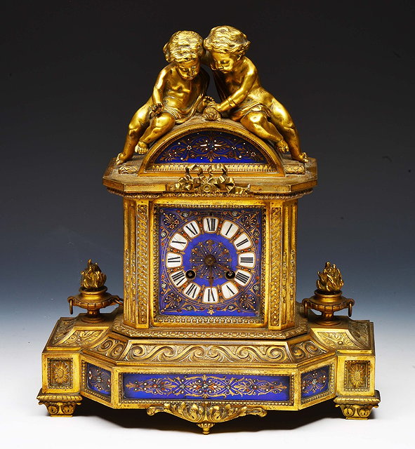 Appraisal: French gilt metal and porcelain mantel clockthe arch case mounted